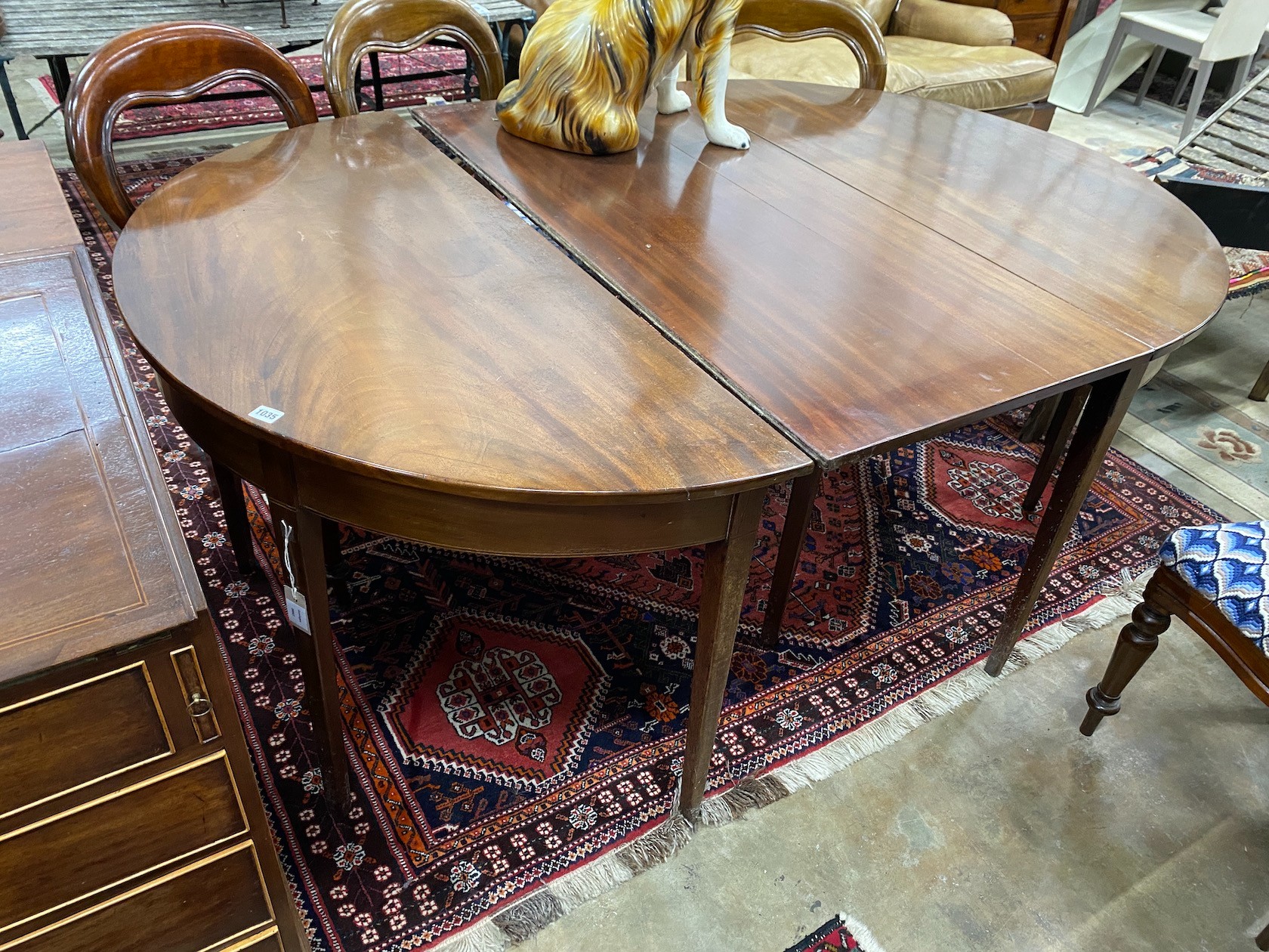 A George III mahogany D end extending dining table with later drop leaf, 180cm extended, depth 127cm height 74cm